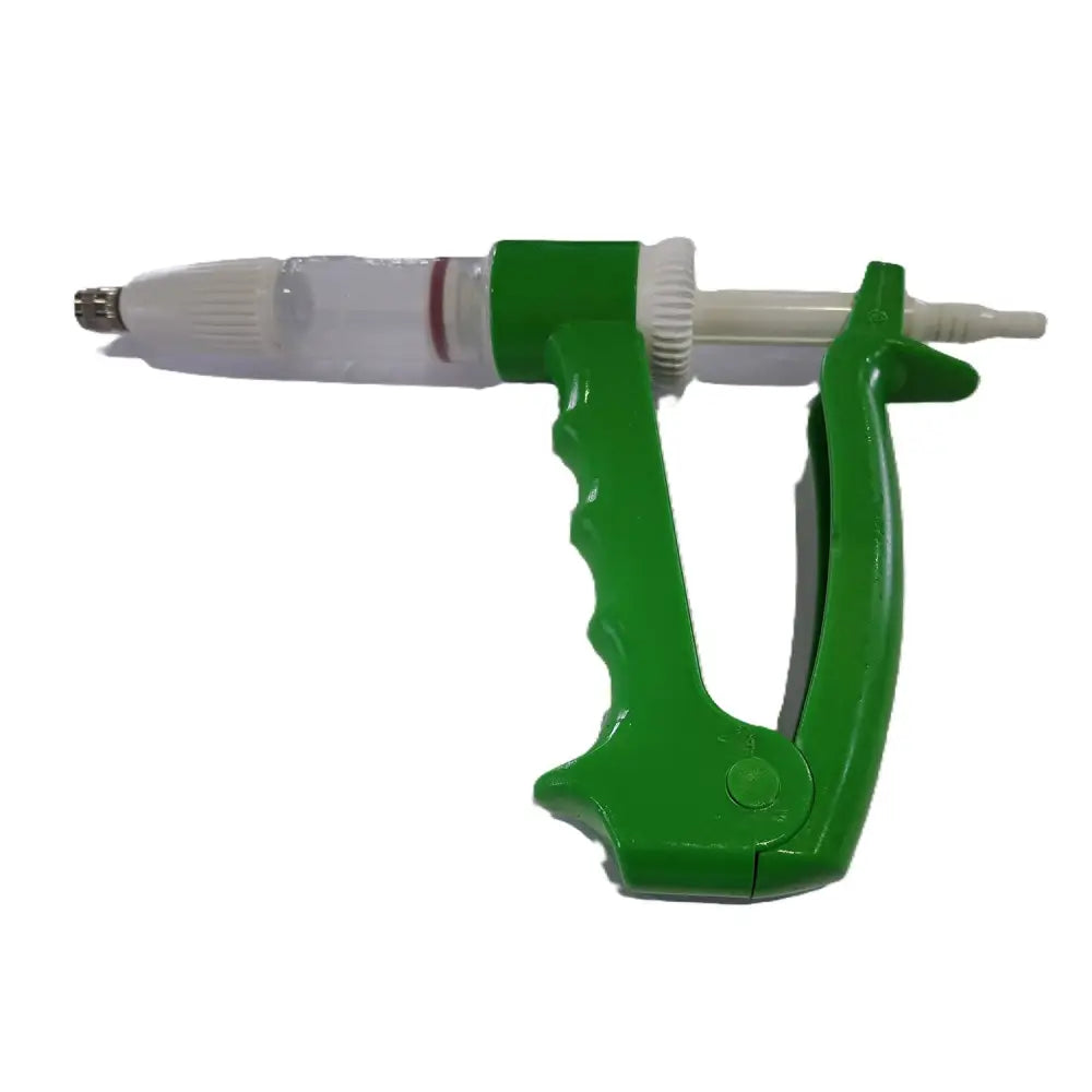 Green plastic veterinary syringe with clear barrel and white plunger farmaco dial-o-dose jector for precise dosing