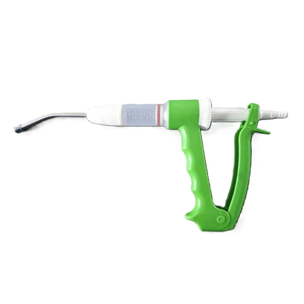Green plastic veterinary syringe with clear barrel and metal needle for farmaco dial-o-doser equestrian use on horses