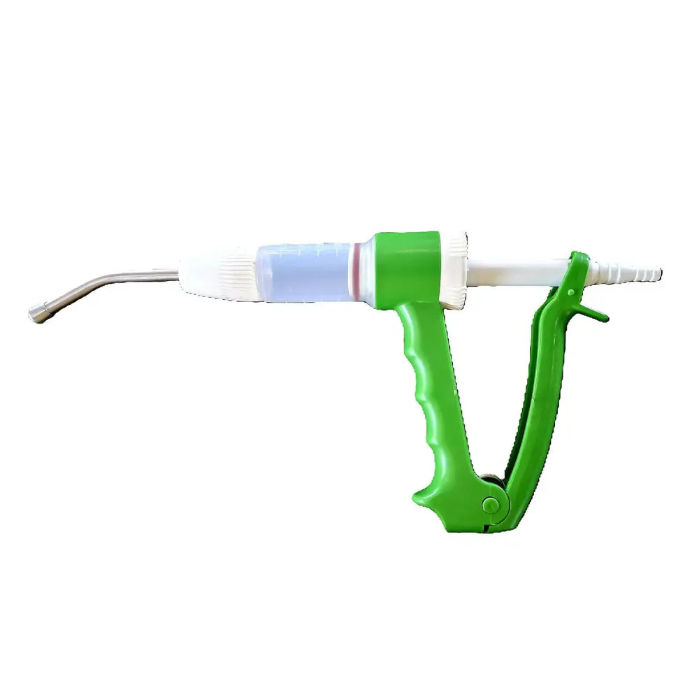 Green plastic-handled farmaco dial-o-doser veterinary syringe with clear barrel and blue liquid for equestrian horses