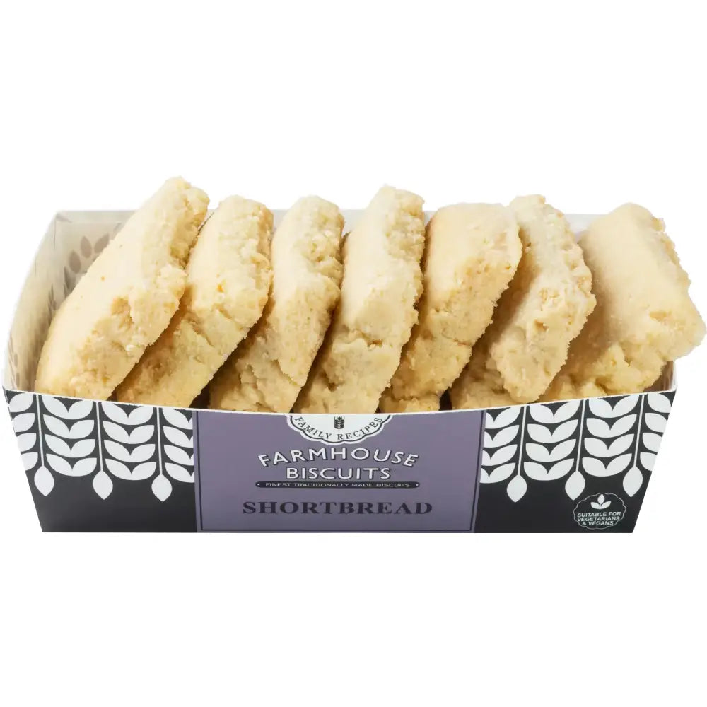A box of farmhouse biscuits shortbread with golden oat flip biscuits in a black and white patterned container with purple label
