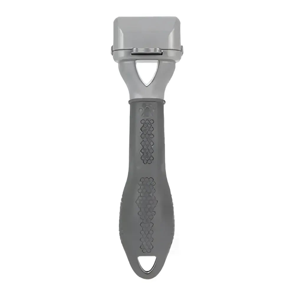 Gray plastic furminator adjustable dematter tool with textured grip and triangular cutout handle for easy pet dematting