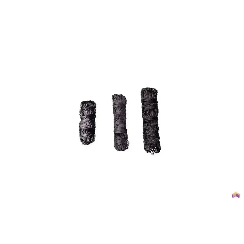 Three black dried sage bundles in a row next to a gallop large haynet with length tie string for easy use