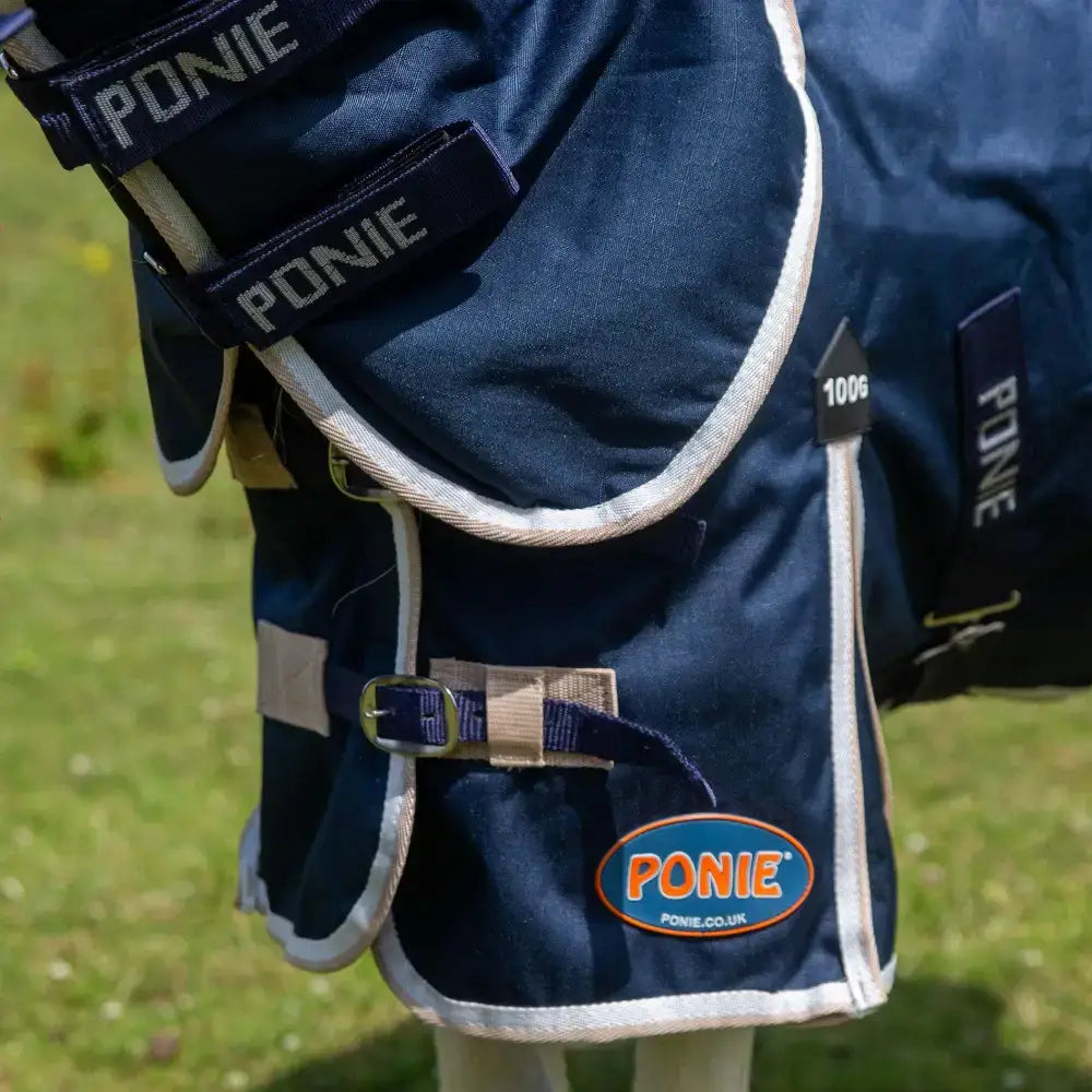 Dark blue gallop ponie duraproof combo turnout rug with white trim and adjustable straps for ponies