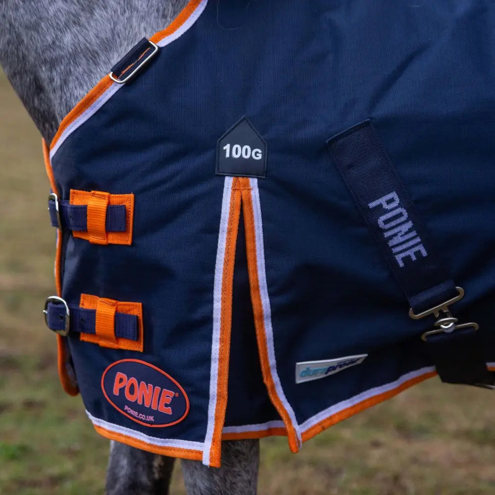 Navy blue and orange gallop ponie 100g lightweight turnout rug with white trim and adjustable straps for ponie duraproof 100g