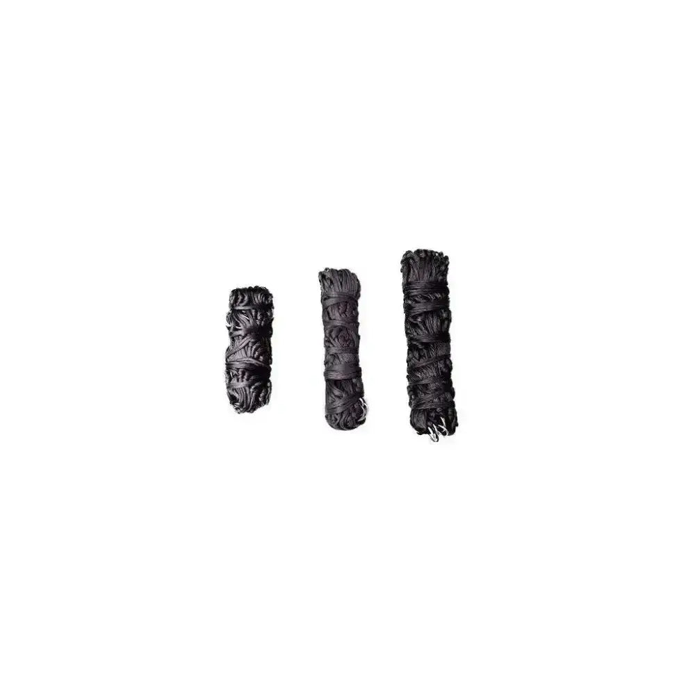 Three black sage bundles with twine showing textures next to a gallop small haynet for small ponies horse feed accessory