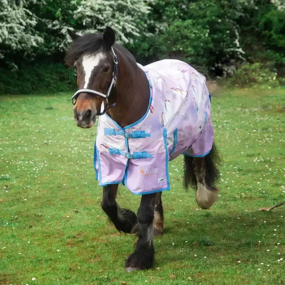 A light purple gallop trojan duraproof pegacorn 0g lightweight turnout rug with blue trim and adjustable straps for horses