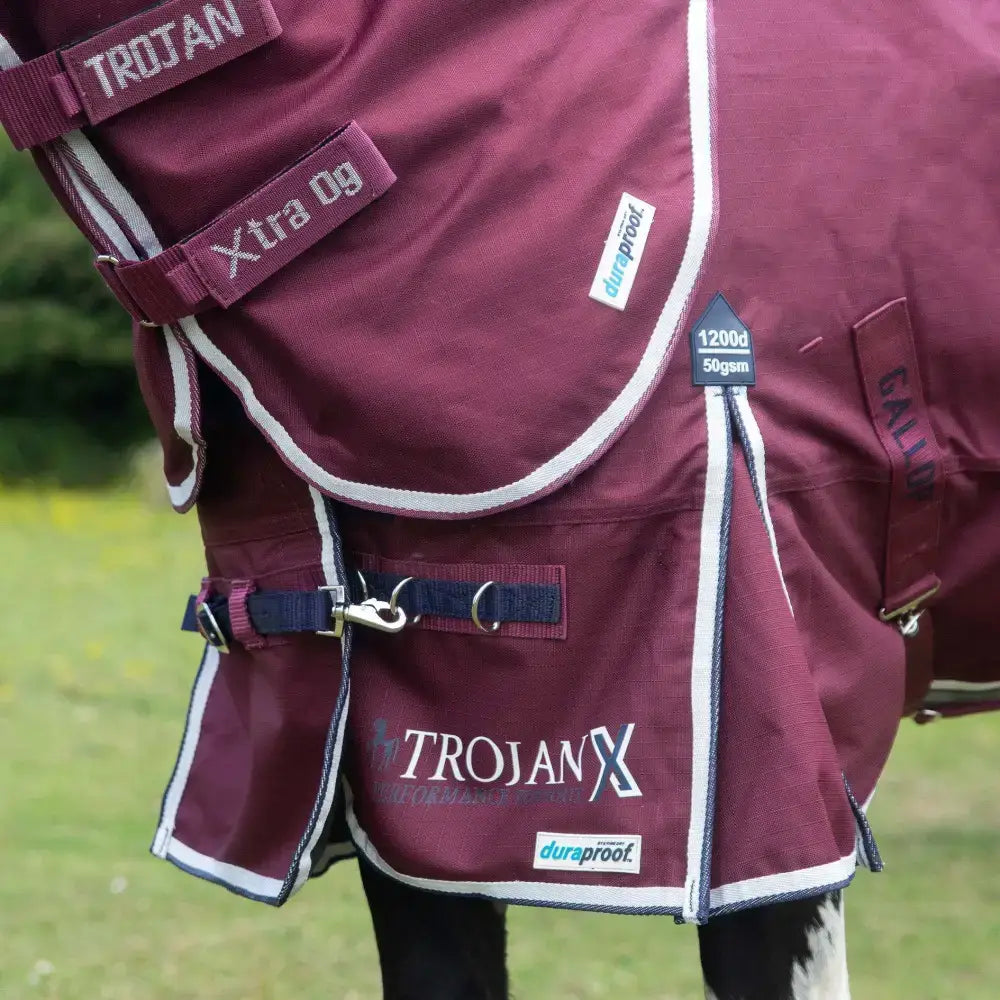 Maroon trojan xtra 50g lightweight standard neck turnout rug with white trim and durable duraproof fabric