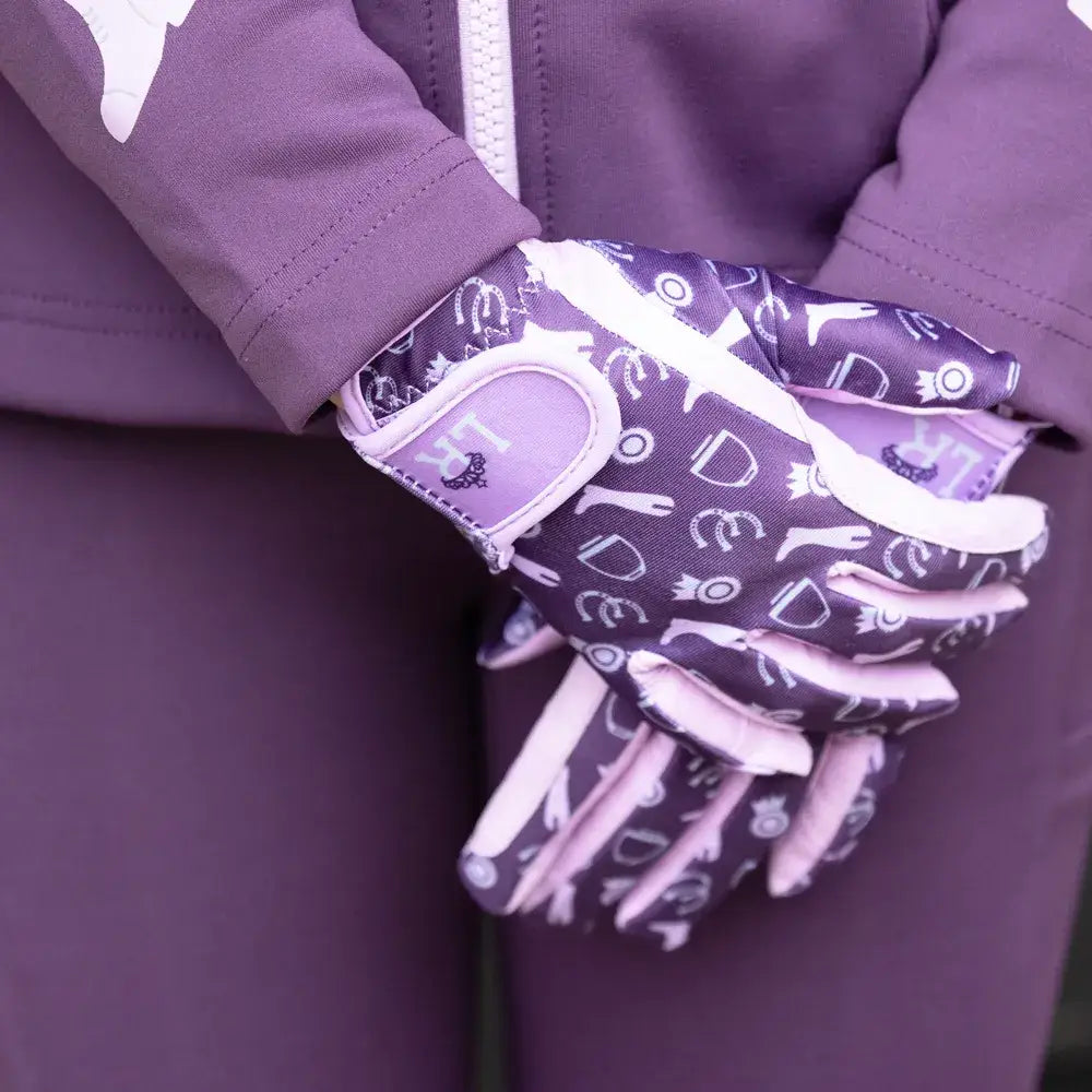 Purple and white gymkhana riding gloves by little rider with horse icon pattern on the back for gymkhana riding