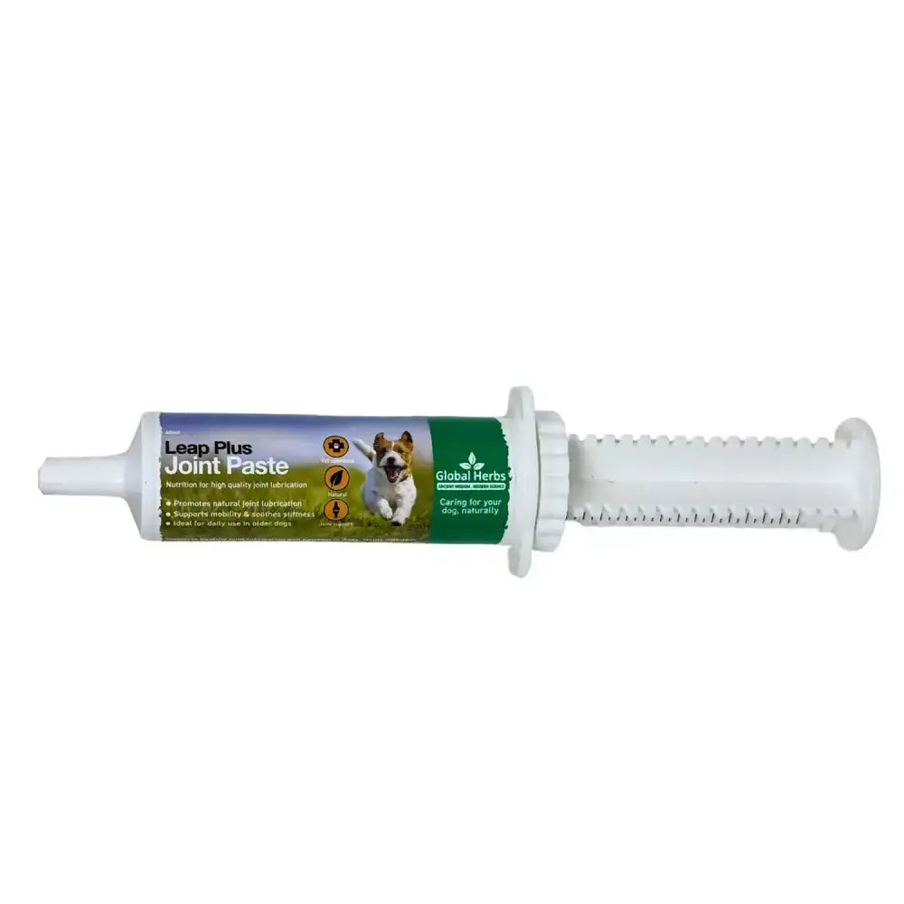 White plastic syringe tube of global herbs canine leap plus joint paste with green purple label and dog image