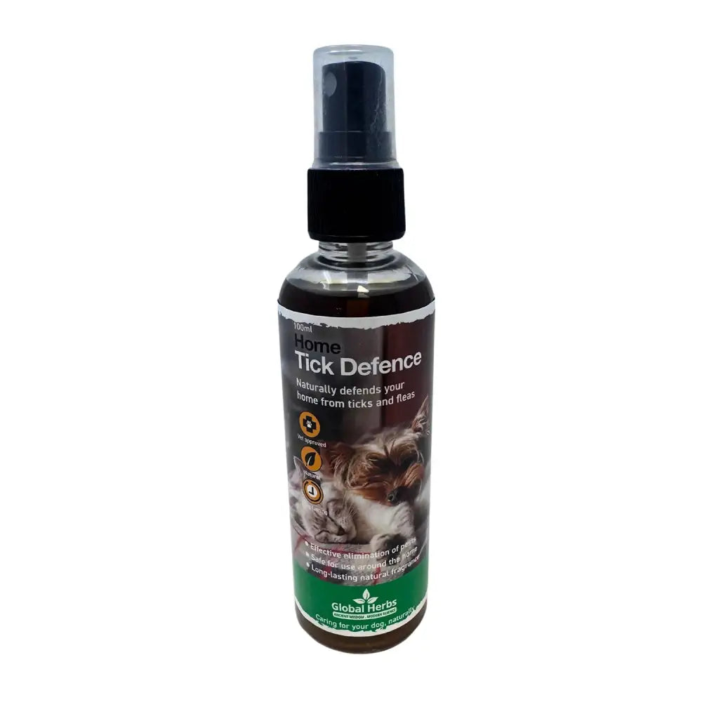 A 100ml transparent spray bottle with black pump labeled home tick defence by global herbs for canine tick defence