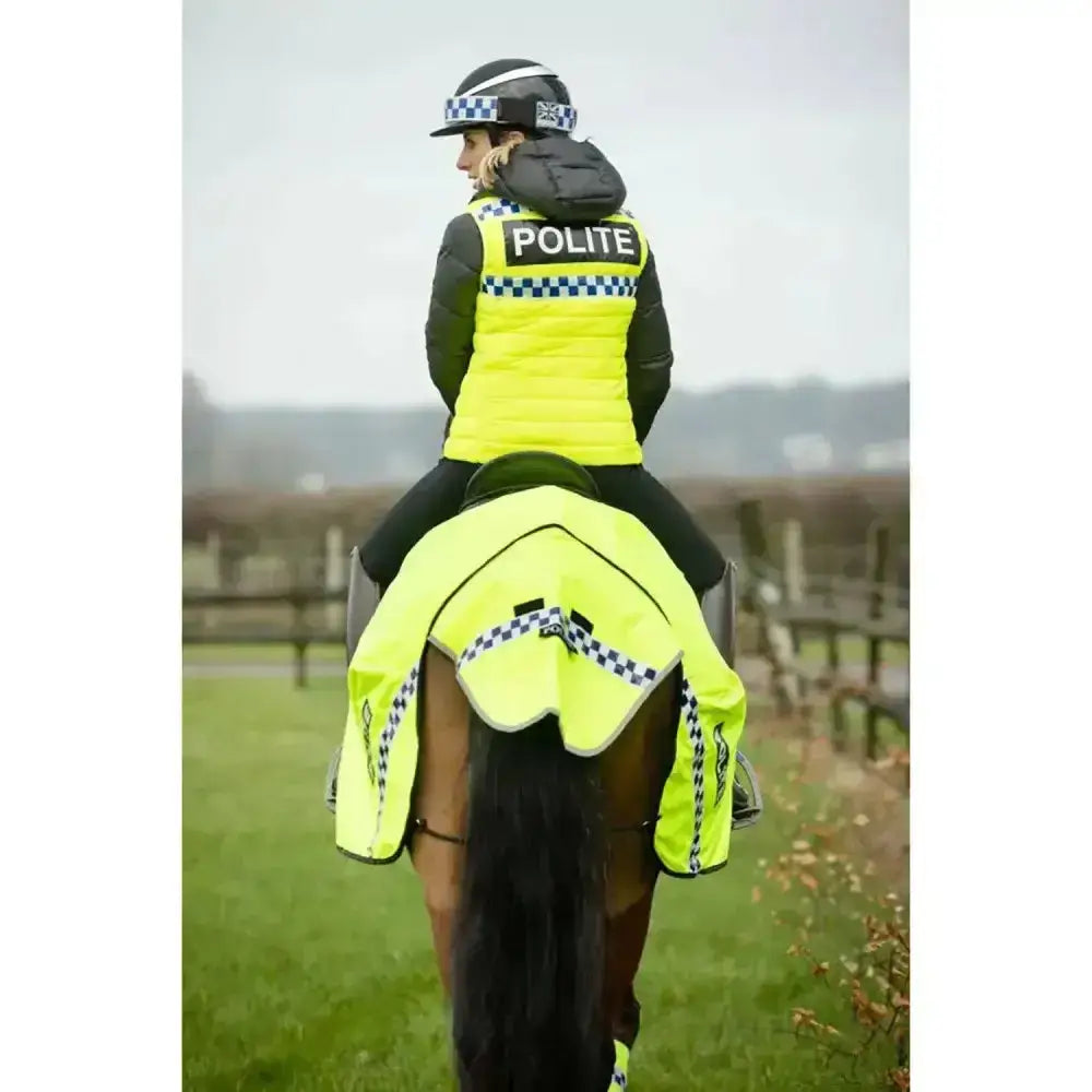 Bright yellow hi-vis equisafety polite winter exercise sheet with black and white checkered trim for police horses