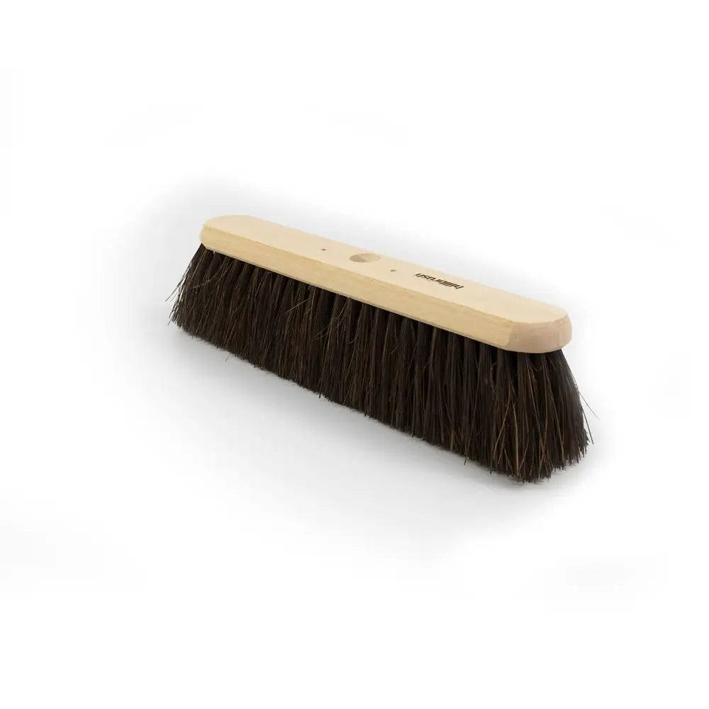A hillbrush trade platform broom head with a light wooden handle and dense dark brown bristles for dry conditions