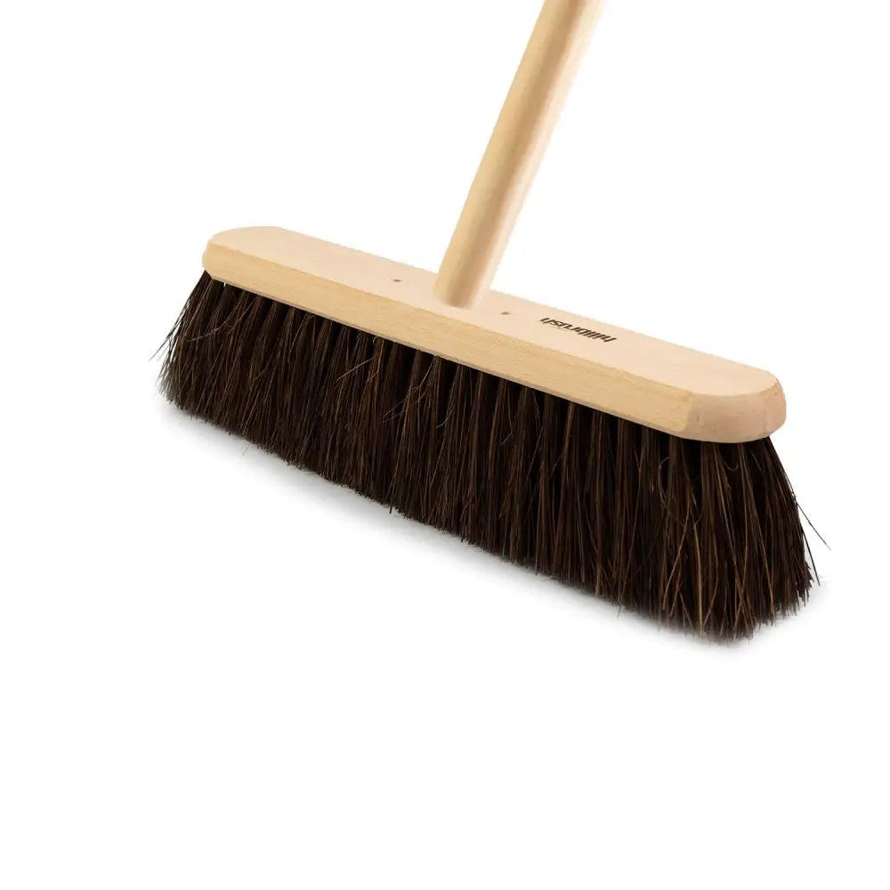 A hillbrush trade platform medium platform broom with a light wooden handle and dense dark brown bristles