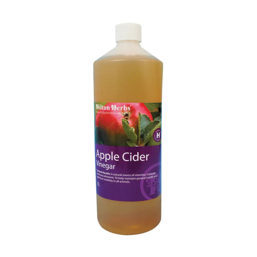 A 1 liter bottle of hilton herbs cider vinegar with a white cap and purple label showing an apple image