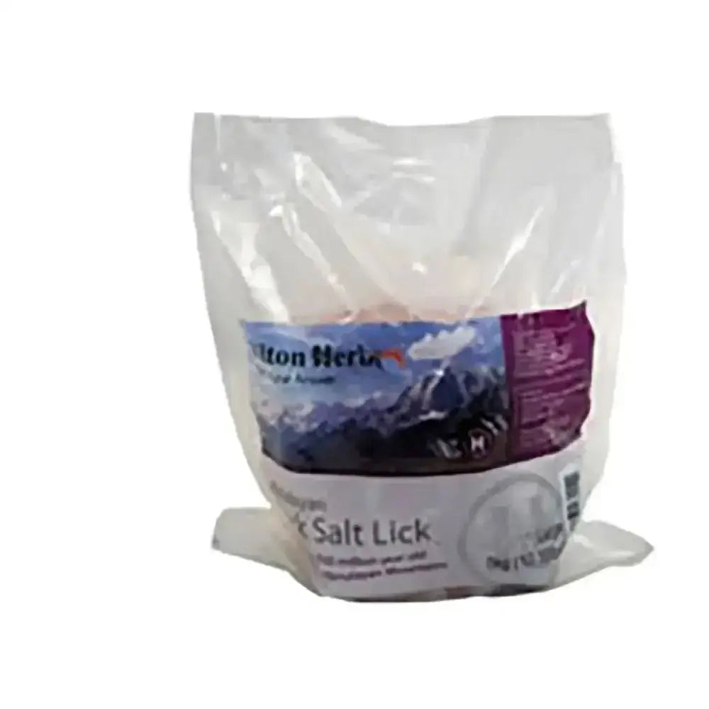 A clear bag of white granulated softer pressed salt labeled hilton herbs himalayan salt lick by bolton herbs