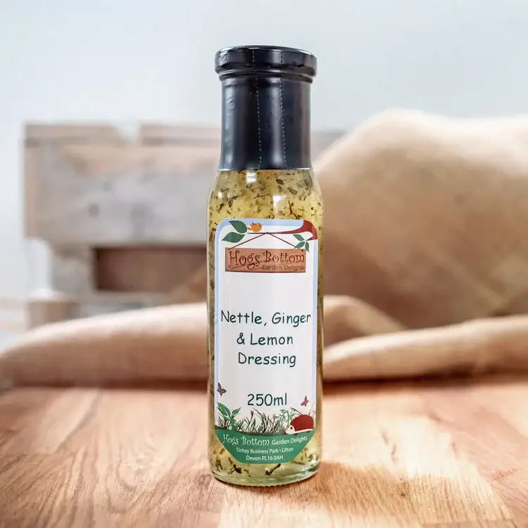 Hogs bottom nettle ginger and lemon dressing 250ml in clear glass bottle with black cap and colorful label for salad use