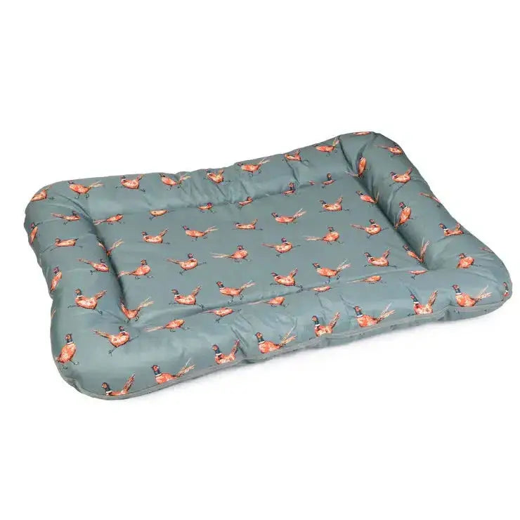 A plush quilted paws water resistant crate mat in muted sage green with illustrated pheasants pattern