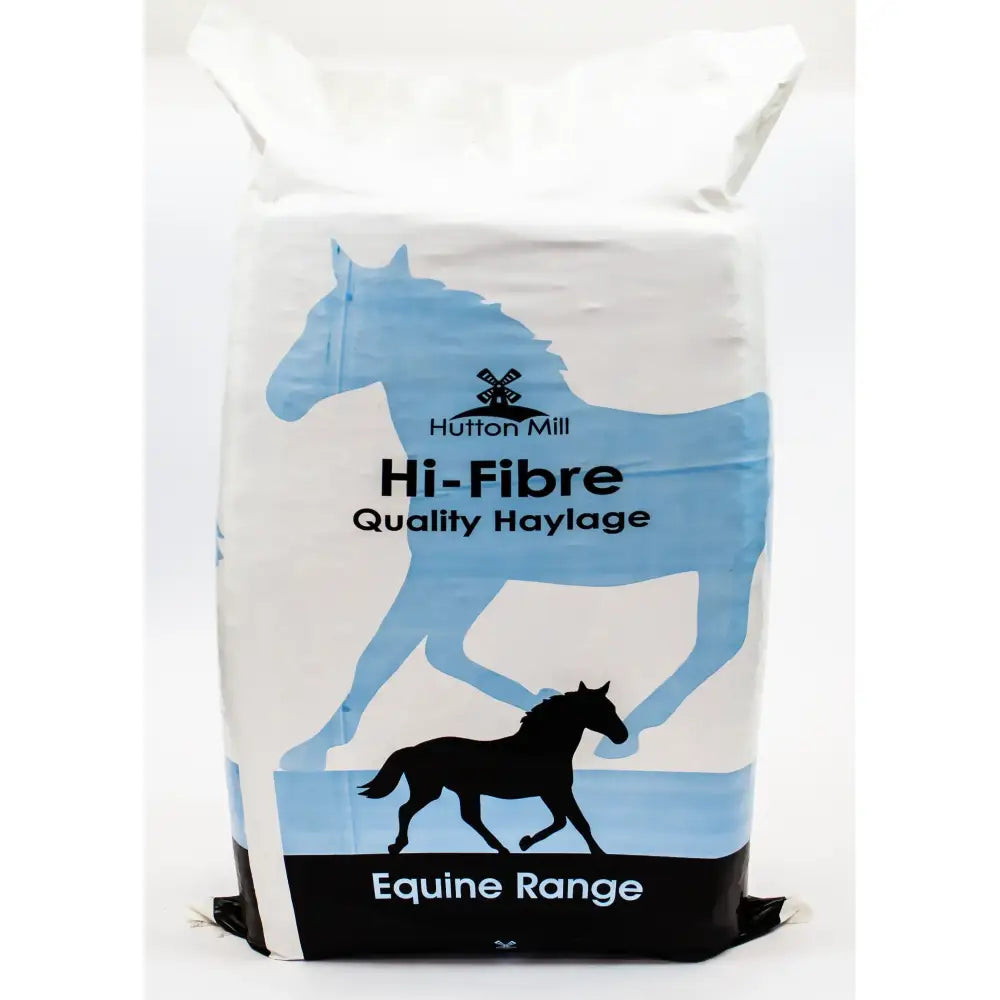 White and blue hutton mill hi-fibre haylage bag with horse silhouettes helping maintain equestrian health 20 kg