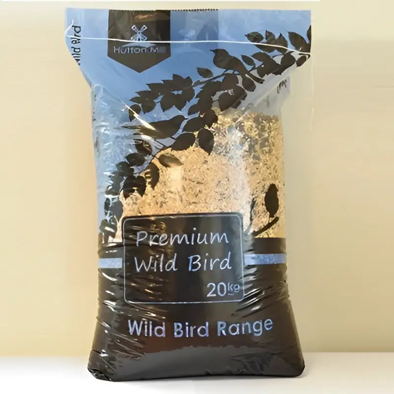 A 20kg bag of hutton mill premium wild bird mix in clear pouch with blue brown label black bird silhouettes