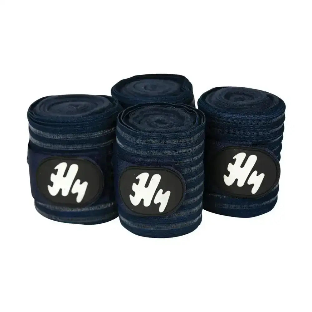 Navy blue h4 horse wrap bands with white logo patches are fully ventilating air flow bandages for horses