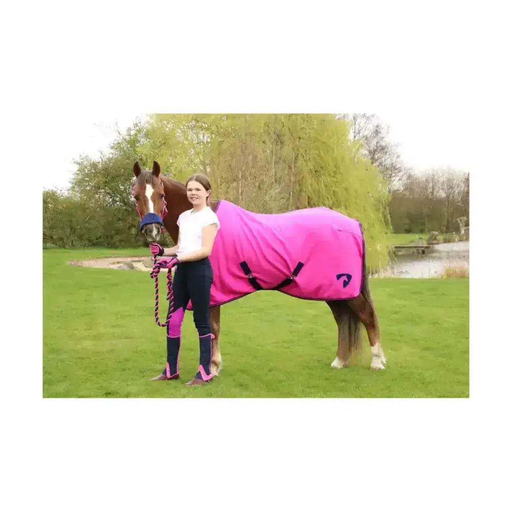 Vibrant pink horse blanket with black straps and small logo, perfect for equestrian belton children’s half chaps use