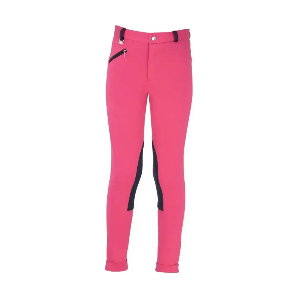Bright pink equestrian belton children’s jodhpurs with black side panels and a zipper pocket on the thigh for everyday use