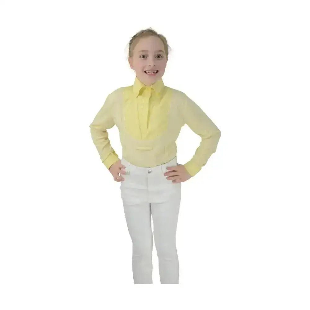 A pale yellow dedham long sleeved equestrian children’s shirt with a crisp collar and front placket