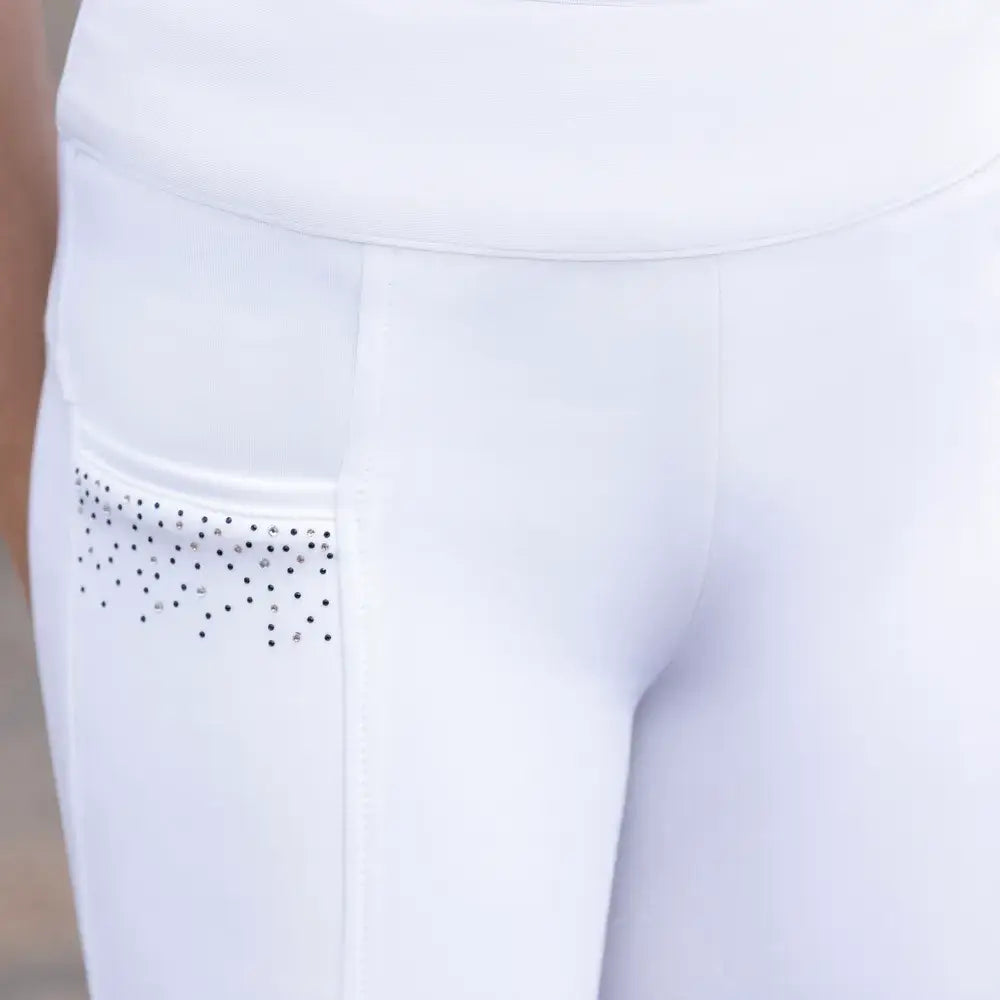 White athletic pants with black and silver rhinestones on side pocket from hy equestrian children’s roka regal riding tights