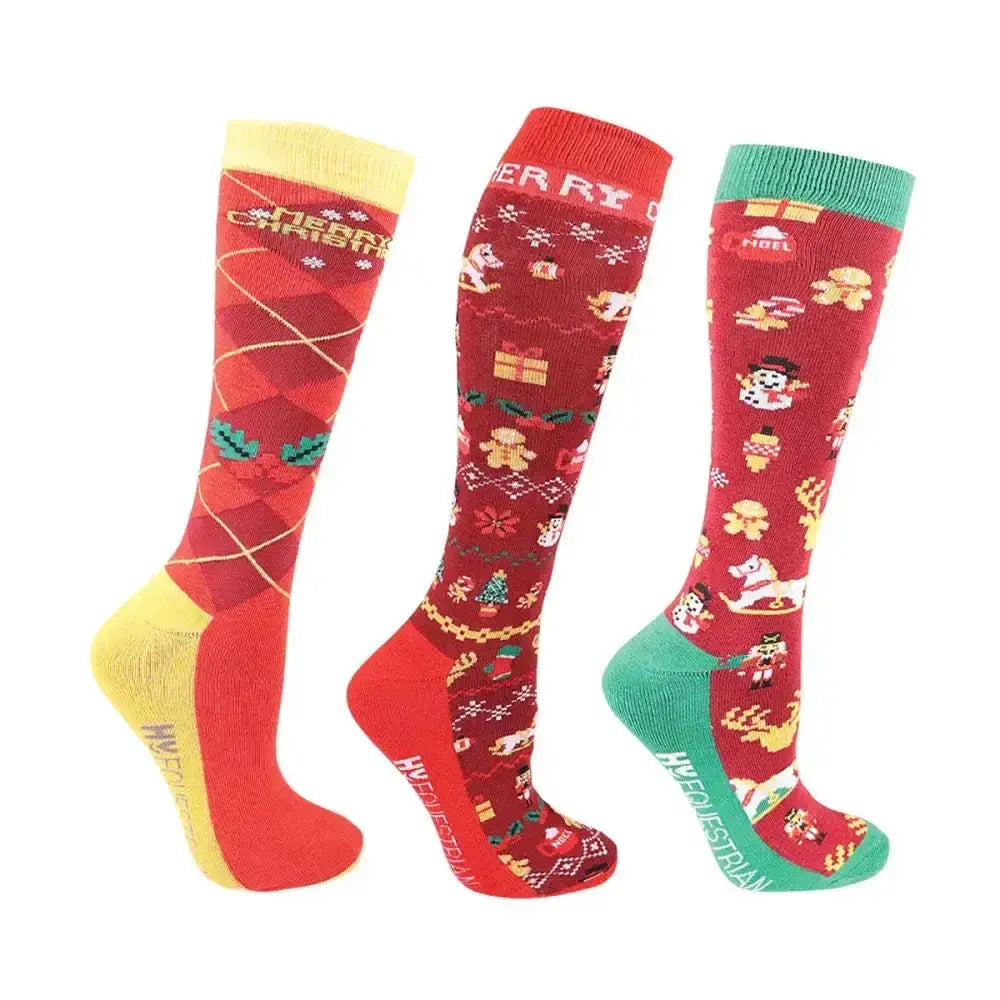 Three festive red hy equestrian christmas cross stitch socks with colorful holiday patterns and contrasting accents