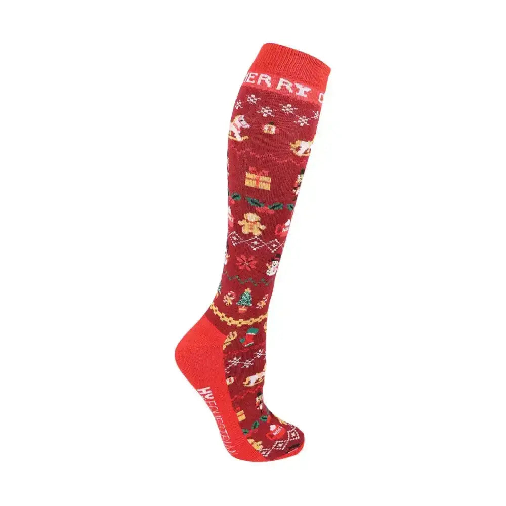 Red knee-high knit cross stitch socks with festive themed designs including gingerbread men and christmas trees for equestrian christmas cross use
