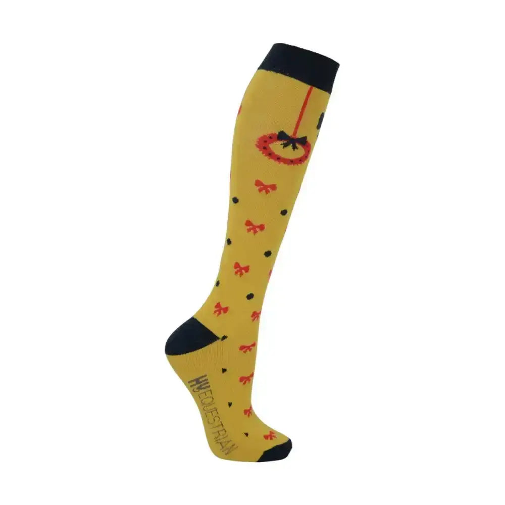 Yellow knee-high equestrian christmas decorations socks with black trim red bows and a festive hanging ornament design
