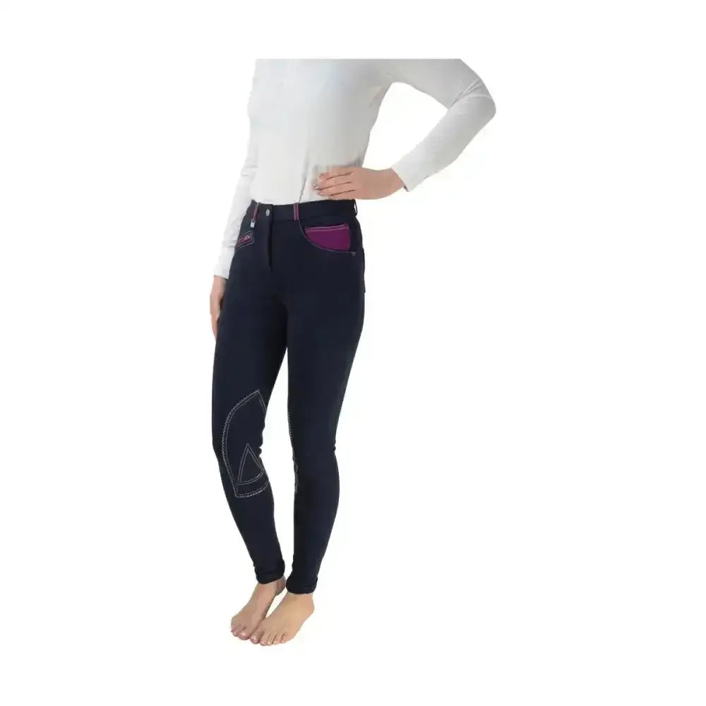 Navy blue equestrian diesel ladies jodhpurs with purple pocket lining and white stitched knee patches for riding