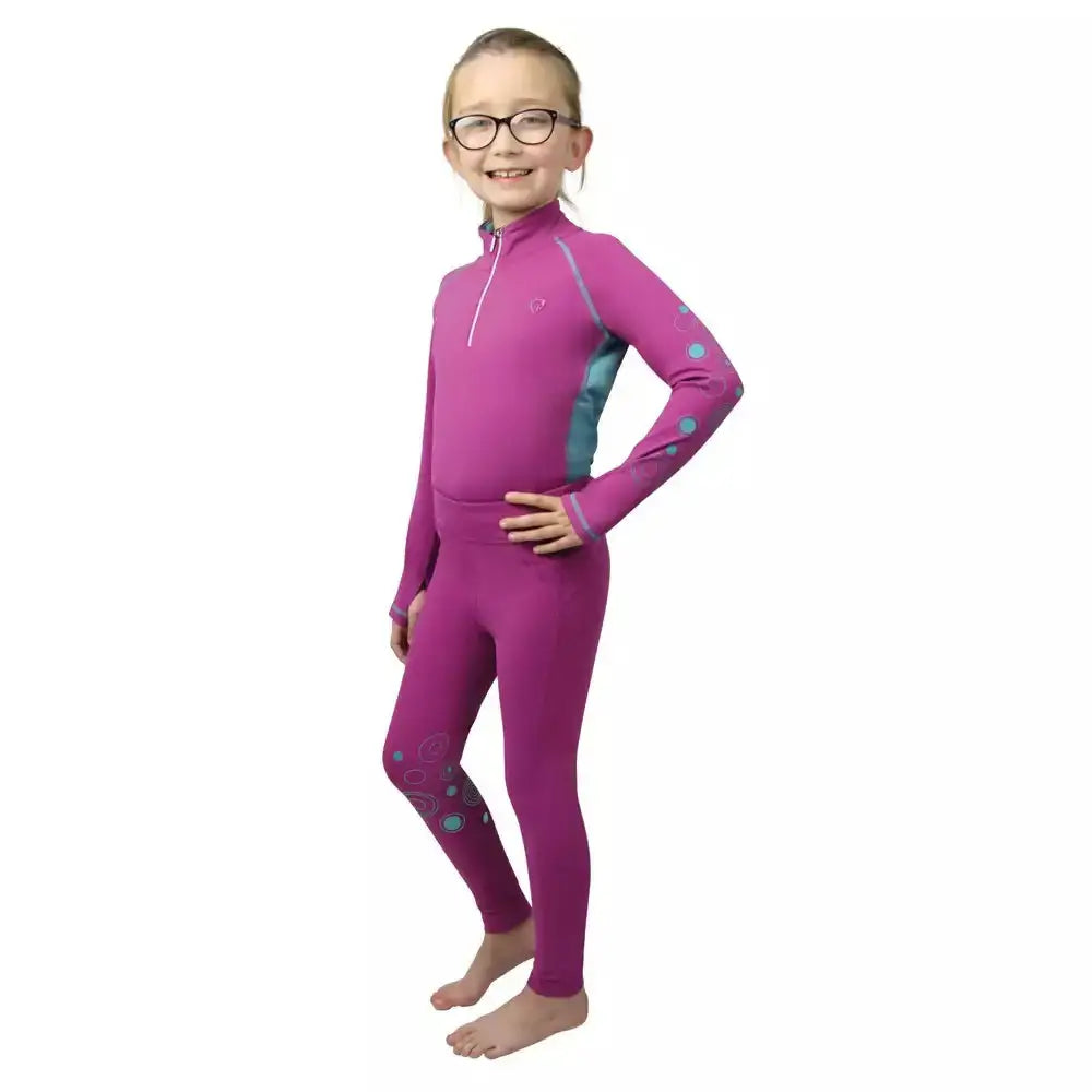 A vibrant magenta hy equestrian dynamizs ecliptic baselayer with teal patterns and zipper for active equestrian use