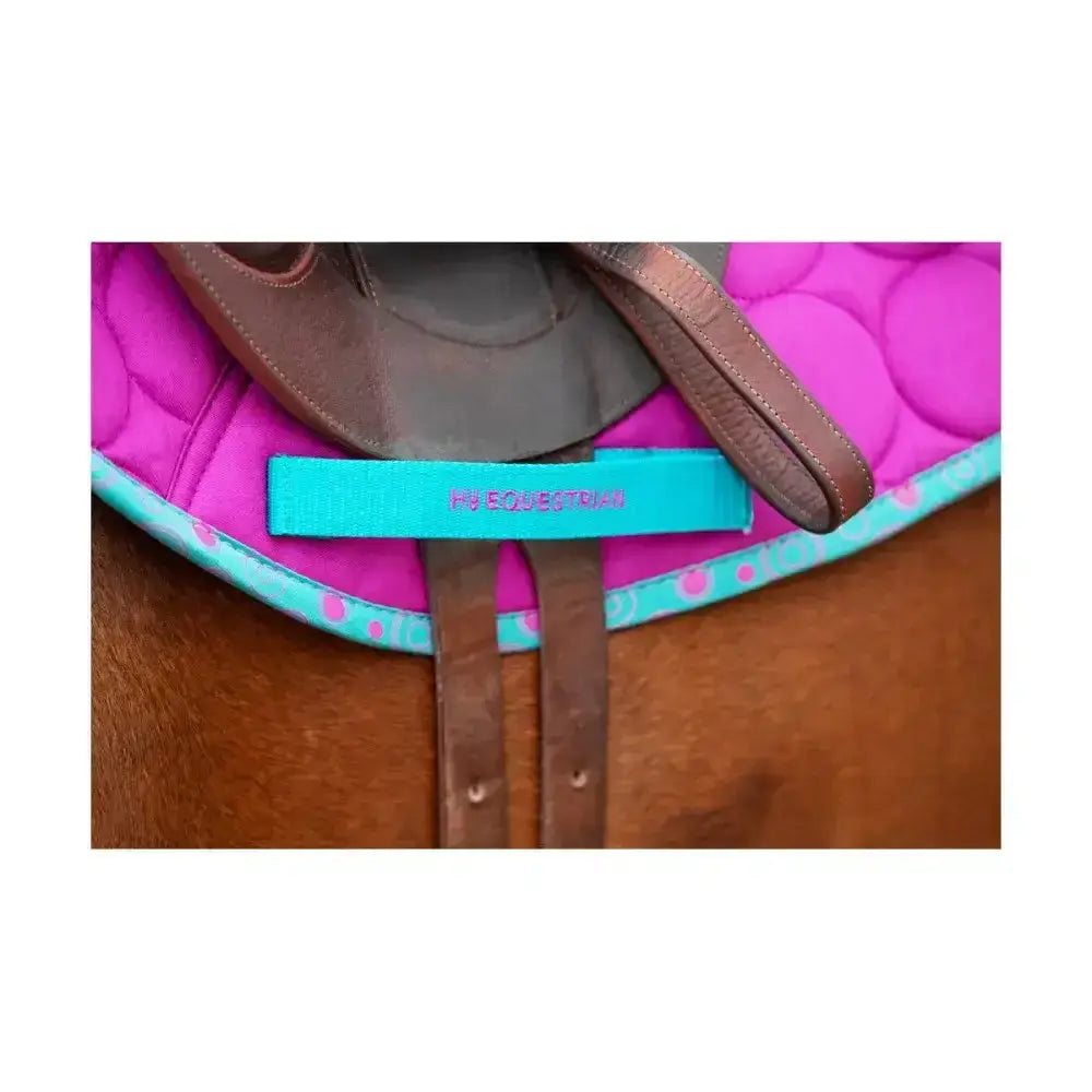 Turquoise strap with h2 equestrian on vibrant pink quilted pad for hy equestrian dynamizs ecliptic close contact saddle