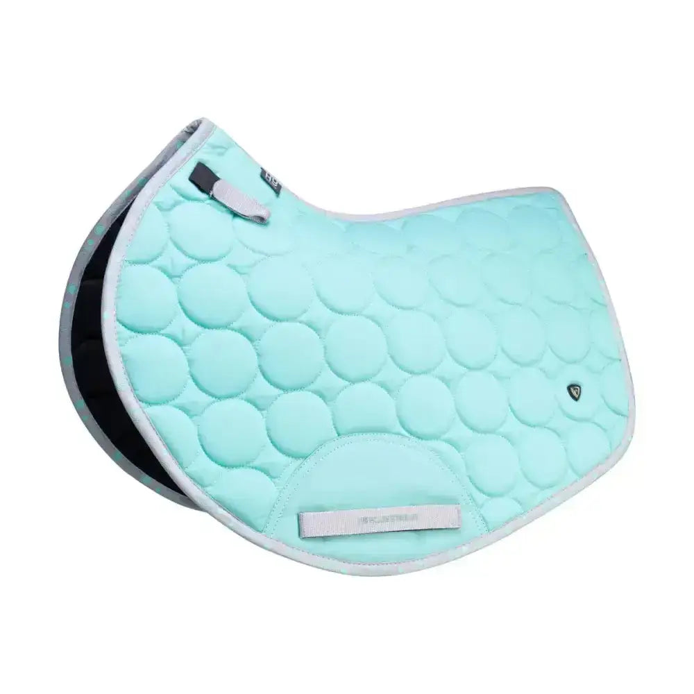 Mint green quilted dynamizs ecliptic close contact saddle pad with gray trim and black lining for equestrian use