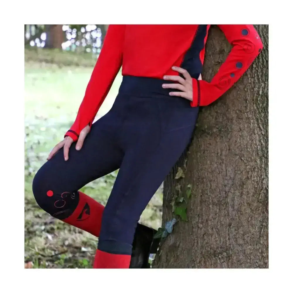 Navy blue equestrian dynamizs ecliptic riding tights with red accents and a playful ladybug knee design