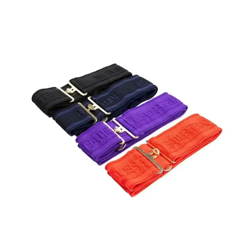Four fully adjustable equestrian elasticated surcingle belts in black navy purple and orange with silver metal buckles