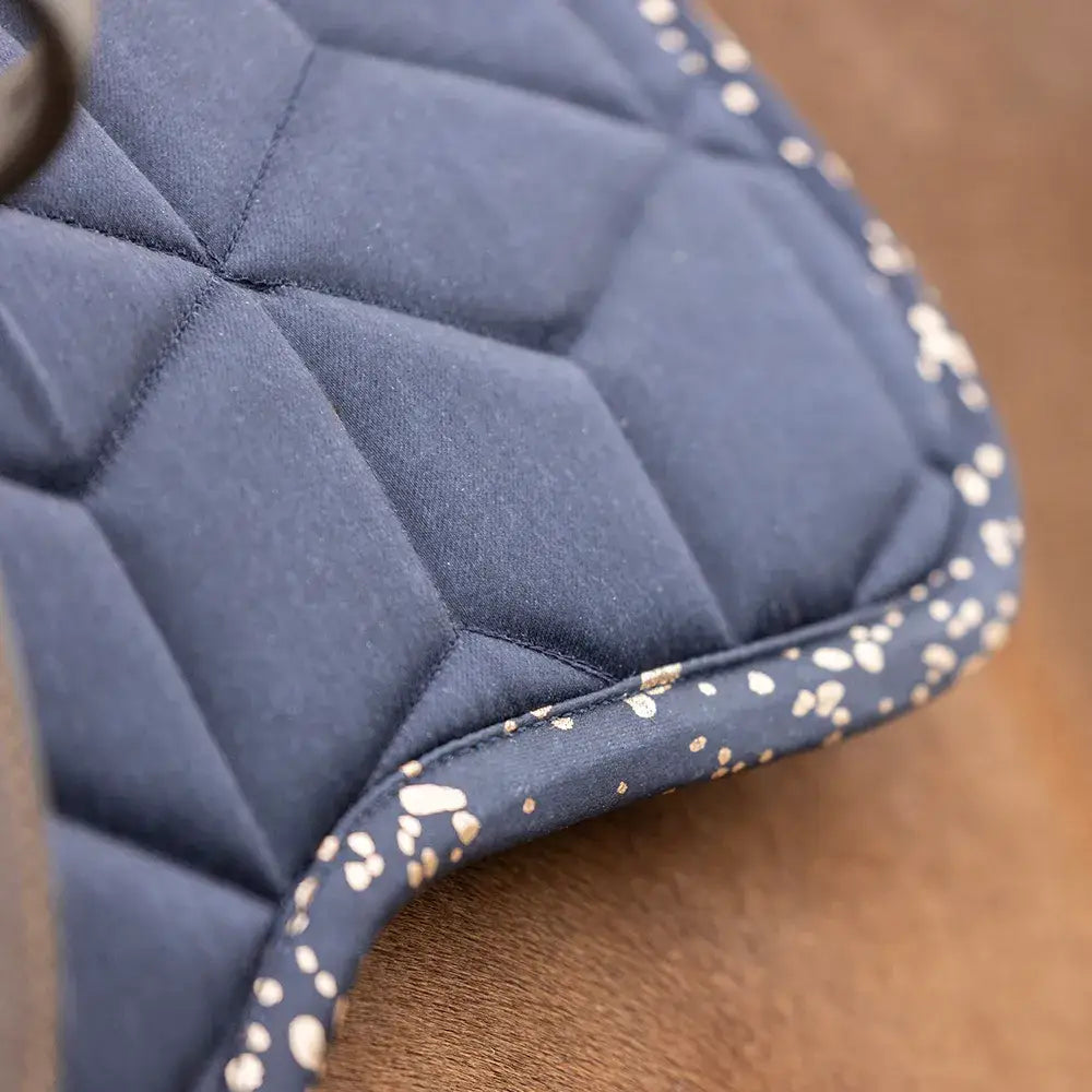 Navy blue quilted saddle pad with gold speckled trim from hy equestrian elevate allure saddle pads collection