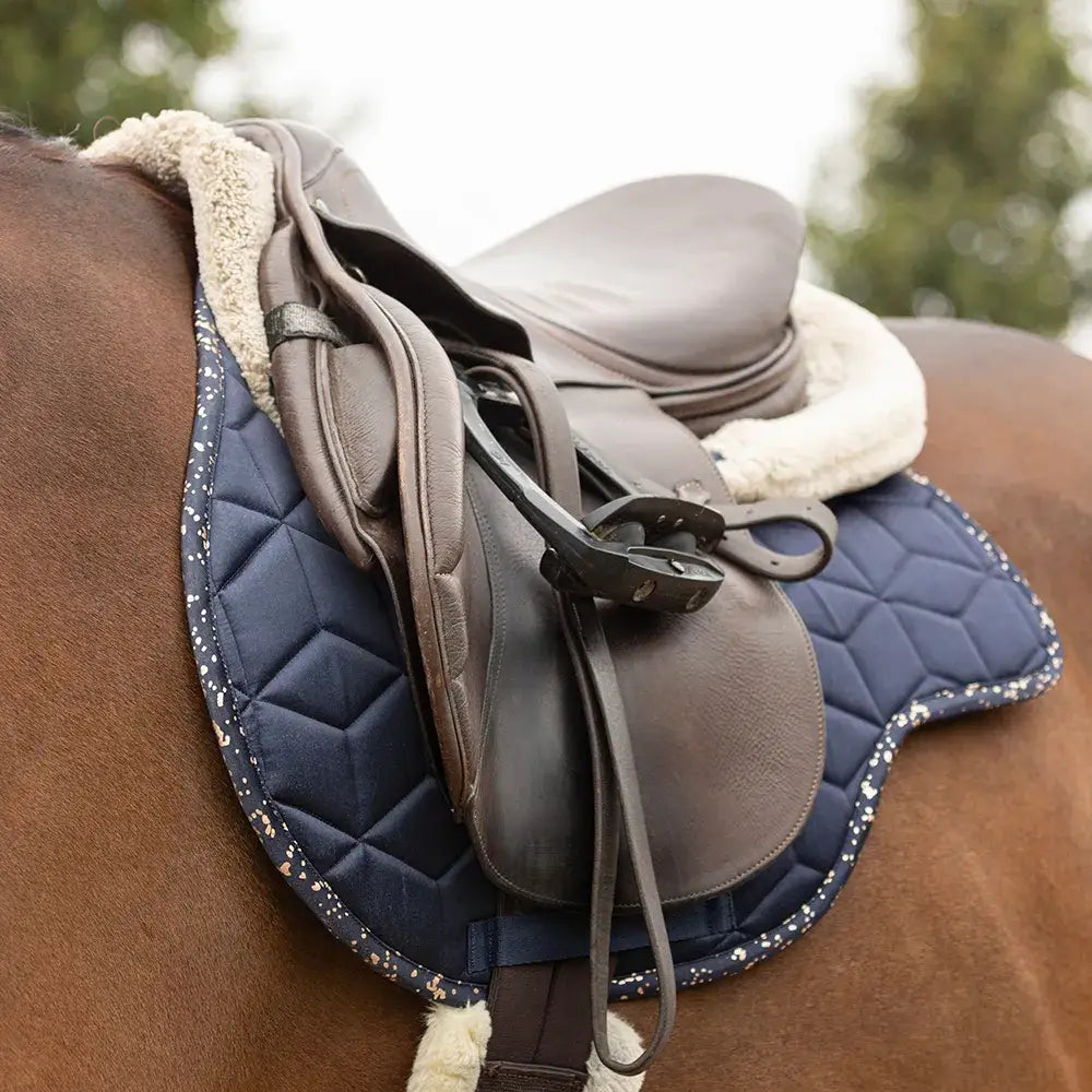 Navy blue quilted hy equestrian elevate allure saddle pad with white speckled trim and plush fleece lining