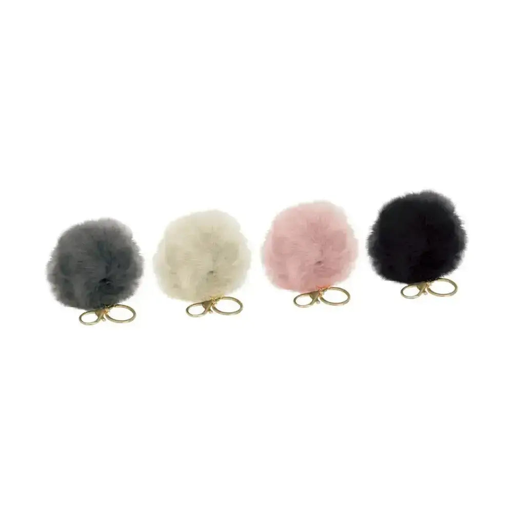 Four fluffy faux fur pom pom key rings in gray cream pink and black from hy equestrian faux fur collection