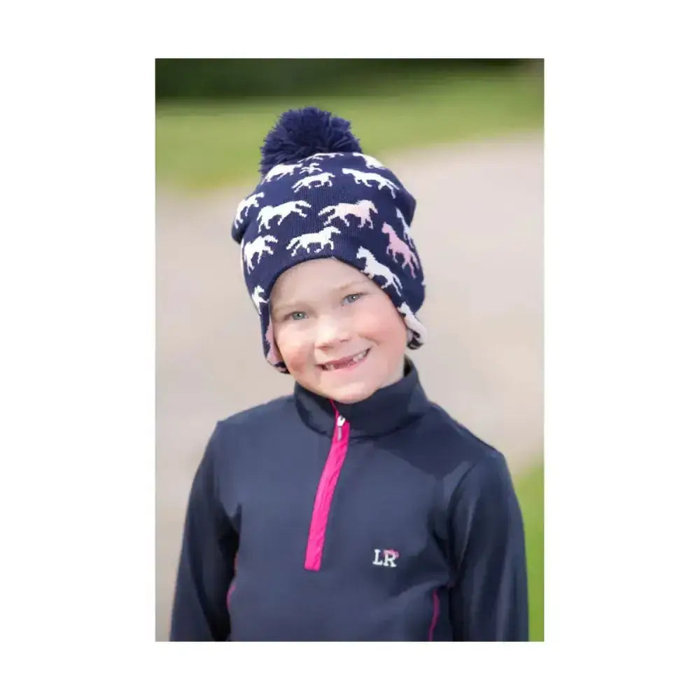 Navy blue knit Hy Equestrian Flaine children’s beanie with fun horse pattern and matching pink white pom pom for pony lovers