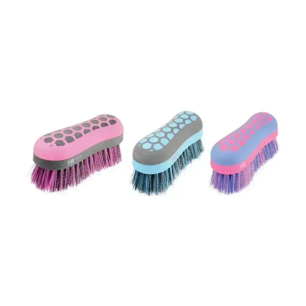 Three colorful hy equestrian glitter dandy brushes with soft bristles and ergonomic honeycomb handles in pastel hues