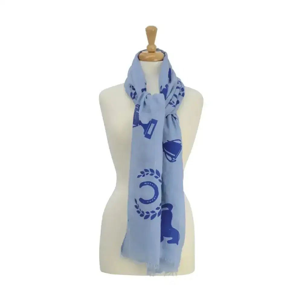 Light blue equestrian ladies balmoral scarf with navy horse shoe prints displayed on a mannequin