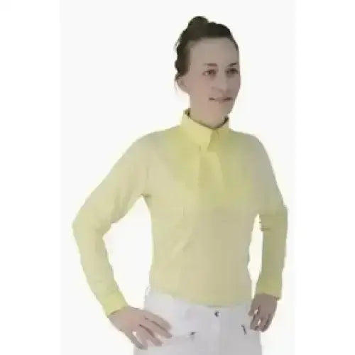 A pale yellow equestrian ladies dedham long sleeved polo shirt with collar and button placket for riding use