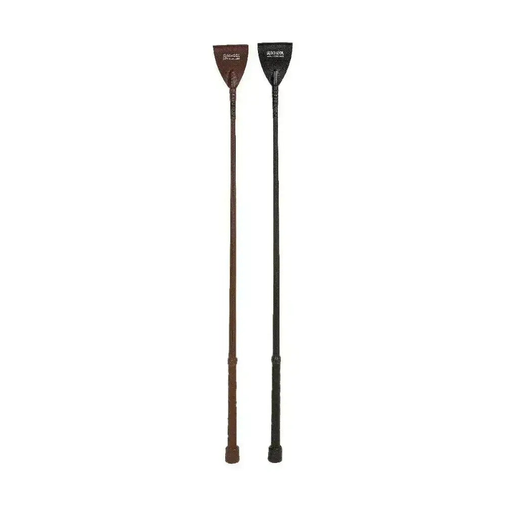 Two equestrian luxury leather whips in brown and black with textured grip and embossed branding on handles