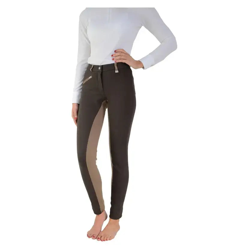 Dark brown manby ladies jodhpurs with tan side panel zipper detail and metallic waistband hardware for equestrian use