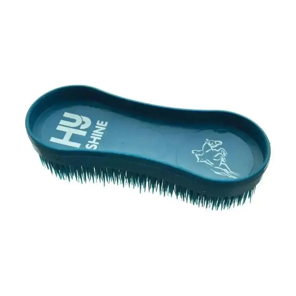 Teal hy equestrian miracle grooming brush with dense dark green bristles and embossed rider silhouette handle