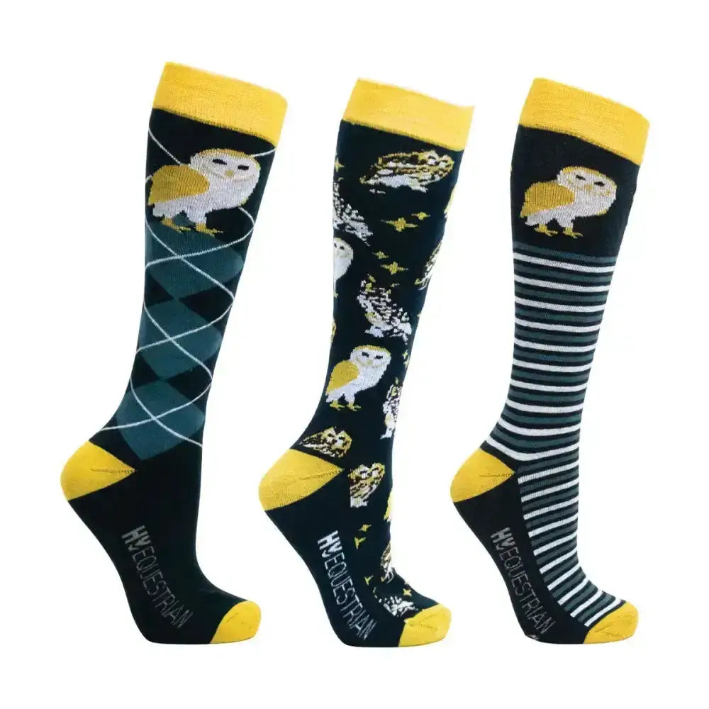 Three pairs of black and yellow hy equestrian night owl socks with repeated owl pattern argyle stars and stripes designs