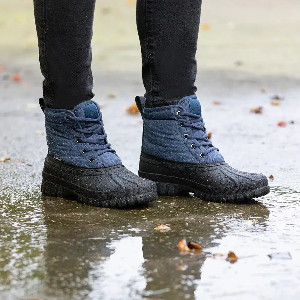 Blue denim-style hy equestrian oxspring waterproof muck boots with black rubber soles and laces for winter use