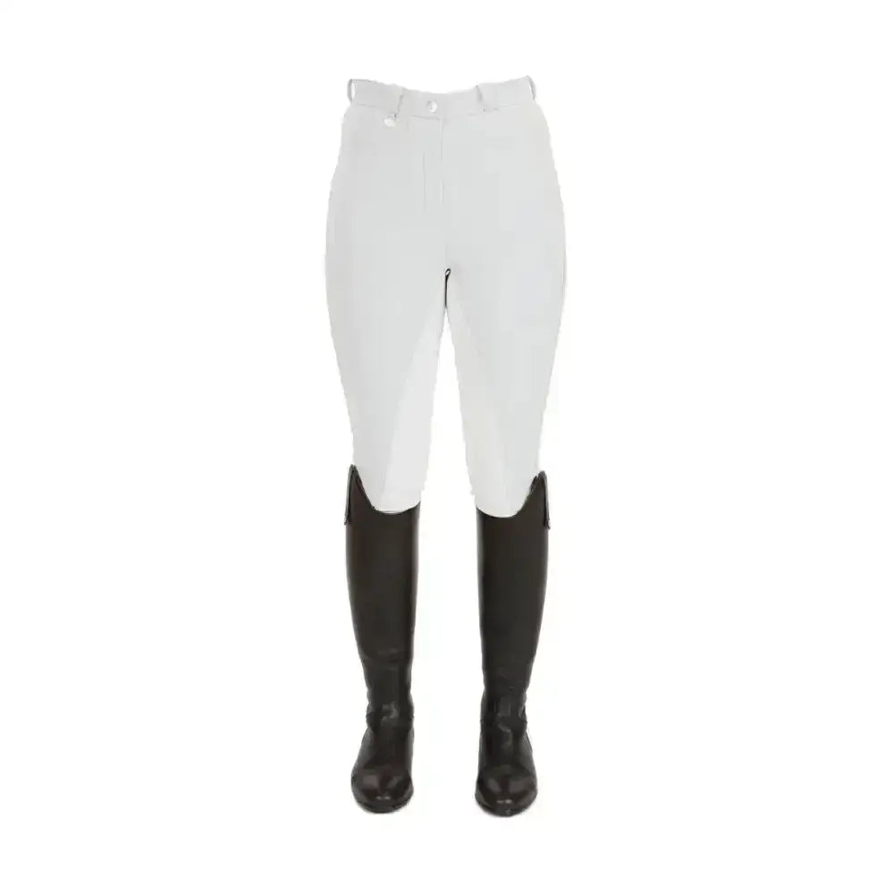 White equestrian pro ladies breeches with black leather boots designed for competitive rider comfort and style